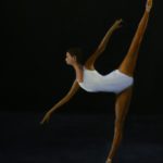 Arsbesque Penche on black background, ballerina in white dance tard.
